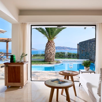 Bedroom at St. Nicolas Bay Resort Hotel  Villas Greece
